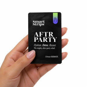 Hand holding a Smart Strips AFTR PARTY sachet, about the size of a credit card