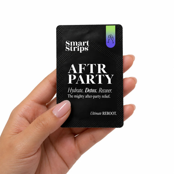 Hand holding a Smart Strips AFTR PARTY sachet, about the size of a credit card