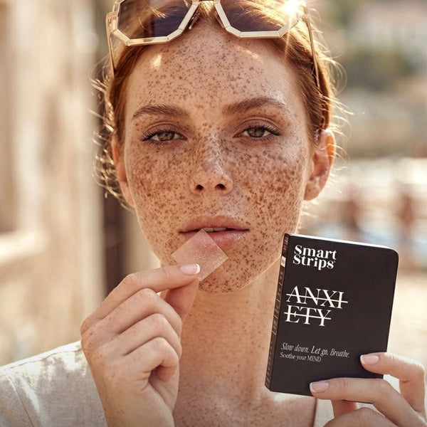 Smart Strips ANXIETY oral dissolvable strips, woman with freckles holding the box