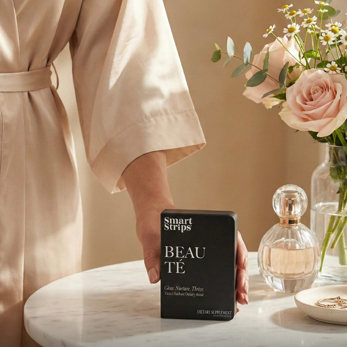 Smart Strips BEAUTÉ oral dissolvable strips, box on a marble table with roses