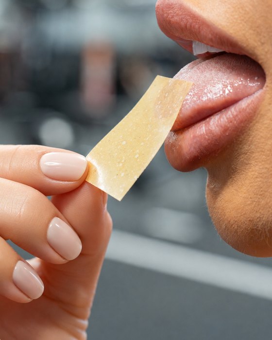 The strip is placed on the tongue